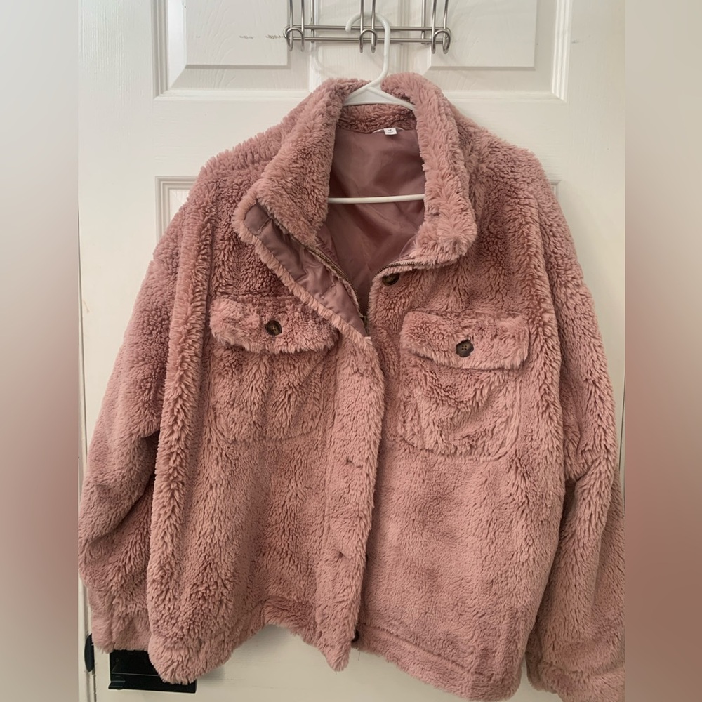 Jacket soft and cozy
Zipper also has buttons 
Has pockets on side